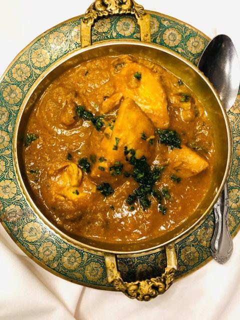 Chicken Curry · Chicken cooked with onion, ginger, garlic, turmeric and other Indian spices.