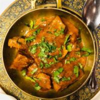Lamb Curry · Lamb cooked with onion, ginger, garlic, turmeric and other Indian spices.