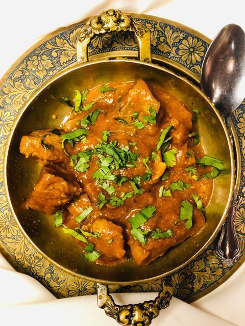 Lamb Curry · Lamb cooked with onion, ginger, garlic, turmeric and other Indian spices.