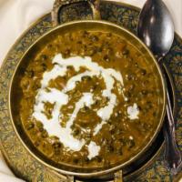 Kali Dal Makhani · Black lentils simmered overnight with tomatoes and ginger.