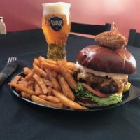 Jalapeno Burger · Stuffed with jalapenos. Topped with lettuce, tomato, Cheddar cheese and our house jalapeno c...