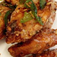 Salt and Pepper Fried Wings · (*S) six fried wings, jalapeno, ginger, garlic, scallion, tossed with a spicy chili butter.
