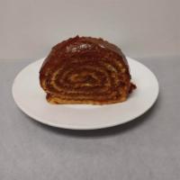 Pionono · A delightfully rolled cake filled and covered with dulce de leche (caramel).