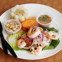 Ceviche de Pescado · Fresh fish and seafood in lime juice mixed with special spices, served with sweet potato and...