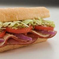 Ham and Cheese Sub · Oven-baked ham, cheese, lettuce, tomato, onion, oregano, and Italian dressing on the side.