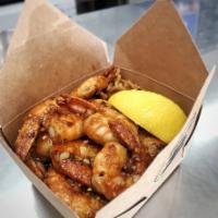 Garlic Shrimps · A dozen jumbo shrimps served over rice or noodles