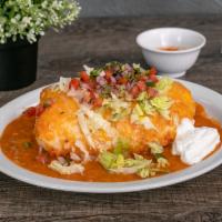 Smothered Burrito · Smothered with green chii and cheese, stuffed with your choice of meat.