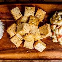 Teriyaki Grilled Tofu · Sautéed tofu topped with teriyaki served with two sides served with a side of white rice and...