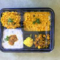Mini Meals Dinner Special · Bisibellabath, curd rice, rce of the day, poriyal, sweet, and papad.