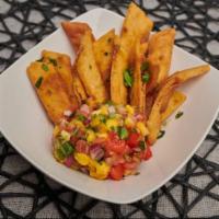 Chips & Salsa · Crispy tortilla chips served with your choice of house-made salsa.  Options are tropical man...