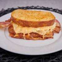 OG Smoke · Two eggs, any style, with thick smoked cherrywood bacon and sharp cheddar cheese, served wit...