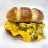 Melted Maniac Burger · Fresh, never frozen burgers! Hot Giardiniera and loads of Cheddar Cheese Sauce.