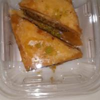 Warbat ( 3 Pieces) · A rich, sweet pastry with layers of filo dough filled with custard and topped with pistachios.