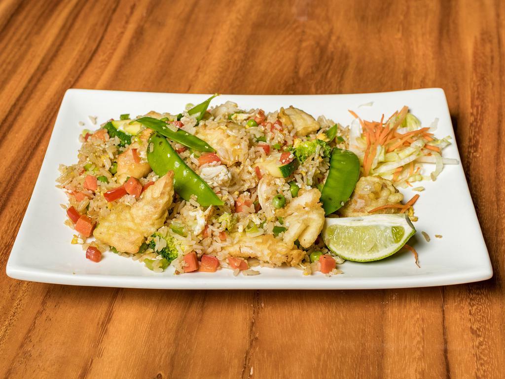 Beef Fried Rice · Stir fried beef with vegetables and sautéed in the chef’s special fried rice sauce.