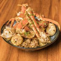 1 lb. Snow Crab Legs, 1 lb. Clam, 1 lb. Shrimp Combo · A meal that combines various types of food or drinks.
