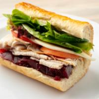 Cranberry Turkey Sandwich · Oven-roasted turkey breast, provolone cheese, tomatoes, mixed greens, jellied cranberry sauc...