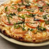 Margherita Pizza · Housemade roasted garlic sauce, mozzarella, tomatoes, Parmesan cheese, fresh basil.