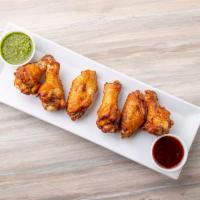 Chicken Wings · Skillet baked chicken wings, hand-tossed in your choice of sauce.