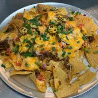 Nacho Platter · Piled high tortilla chips topped with queso cheese, taco meat, onions, green peppers, totato...
