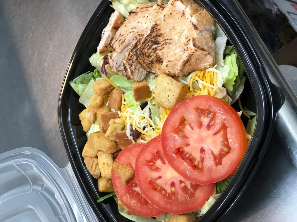 Classic · Mixed greens, cabbage, carrots, diced tomatoes, cucumbers, and shredded cheddar jack cheese. Served with your choice of dressing. Add chicken for an additional charge.