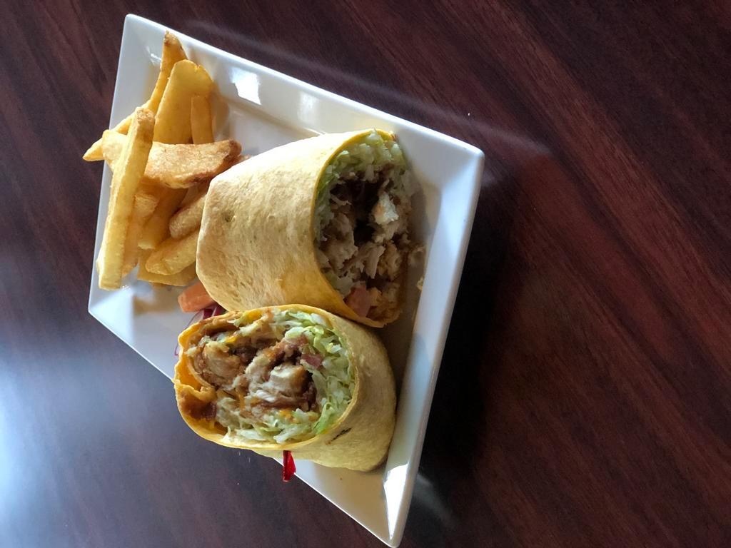 Chicken Bacon Wrap · Crispy or seasoned grilled chicken, lettuce, tomato, smoky bacon, and house-made ranch dressing. Served in our cheddar jalapeno wrap. Add Buffalo sauce for an additional charge.