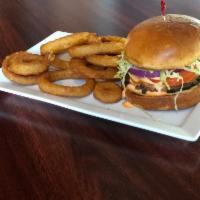 Social Burger · Topped with melted Gouda cheese, lettuce, tomato, onion, and house-made Sriracha ranch dress...