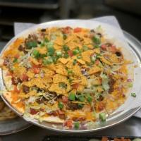 Taco · Thin crust topped with taco meat, black olives, onions, salsa, cheddar-jack & mozzarella che...