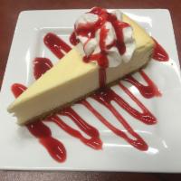 New York Cheesecake · A slice of New York cheesecake topped with your choice of chocolate, or caramel sauce. 