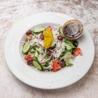 Greek Salad · Vegetarian. Feta, pepperoncini, kalamata olives, lettuce, tomato, cucumber, and onion.
