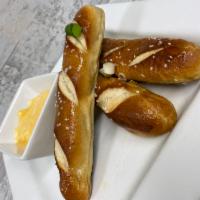Pretzel Rods · Baked pretzel rods served with house made Sam Adams beer cheese sauce.