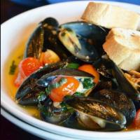 Steamed Mussels · Fresh mussels served in a white wine and lemon sauce with fresh minced garlic, chili flakes ...