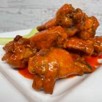 Chicken Wings · our In-house seasoned chicken wings tossed in choice of sauce, served with celery, carrots a...