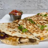 Steak Quesadillas · Hand sliced steak, mushrooms, onions and melted mixed cheese topped with chipotle mayonnaise...