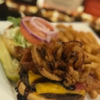 Jack Daniels Burger · Topped with cheddar cheese, bacon, house made Jack Daniels sauce and fried onion straws, ser...