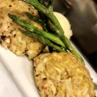 Crab Cakes · 2 broiled crab cakes made up of our signature blend of spices, served with two sides