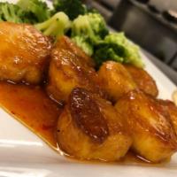 Seared Scallops · Pan seared scallops in an orange sweet Thai chili sauce, served with two sides.