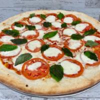 Margherita Pizza · Fresh mozzarella slices, tomatoes and fresh basil. Vegetarian.