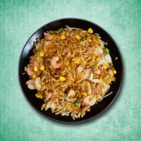 Wok Tossed Shrimp Rice · Tender seasoned shrimp stir fried with eggs, vegetables and rice.

