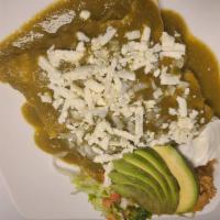 Enchiladas Verdes · Four corn tortillas rolled with chicken in tomatillo salsa, topped with lettuce, tomato, che...