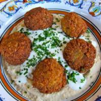 5 Piece Falafel · Made from peas ground with seasoning and herbs fried in ball shaped pieces.