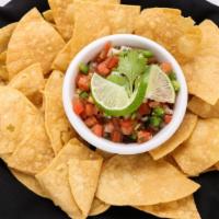 Tortilla Chips · House-made tortilla chips served with a dip of your choice.