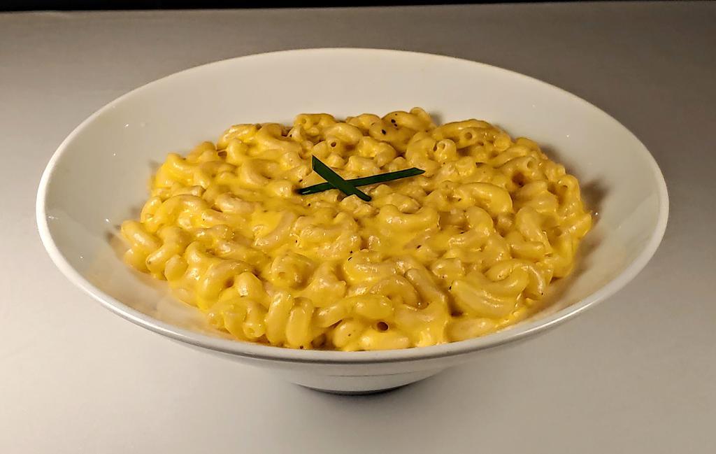 Classic Mac & Cheese · Cheddar and Monterrey Jack cheese melted with cream and tossed with elbow pasta.