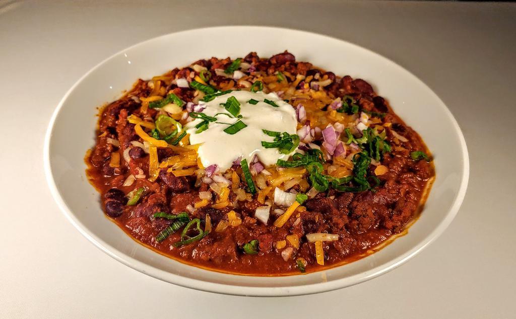 Bison Chili · Chili of All American Bison / Vegetables / Beans 
Topped with Red Onions / Sharp Cheddar / Sour Cream