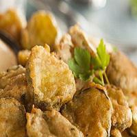 Fried Pickle Chips (12) · Breaded pickle chips served with our home made ranch dressing.