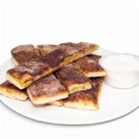 Cinnamon Sugar Bread Stix · Breadsticks sprinkled with a Cinnamon-Sugar mix, then topped with Vanilla Icing.