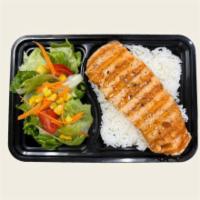 Grilled Salmon Teriyaki · Grilled salmon, sesame seeds served with salad and jasmine rice.