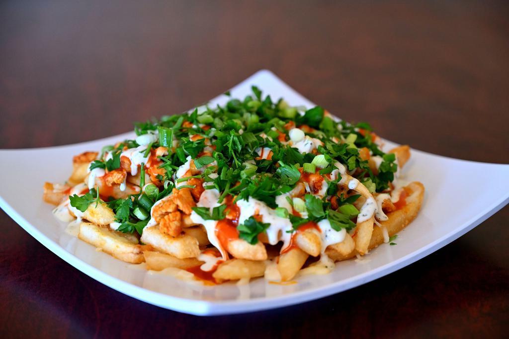 Buffalo Chicken Fries · Ingredients:  Chicken Meat marinated with original Buffalo Sauce. Fries, Mix of three kind of Cheese ( Jack, Cheddar and Mozzarella) Ranch Dressing, Buffalo Sauce, Parsley and Green Onion on the top.