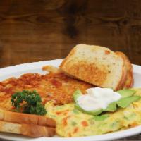 Mexican Omelet · Tomato, Onion, Bell Pepper, three eggs, Avocado and sour cream on the top . Served with hash...