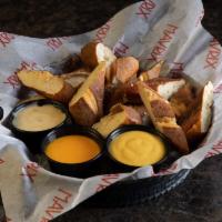 Pretzel Bites · Soft and delicious deep-fried pretzel bites, served with queso dipping sauce nacho cheese an...