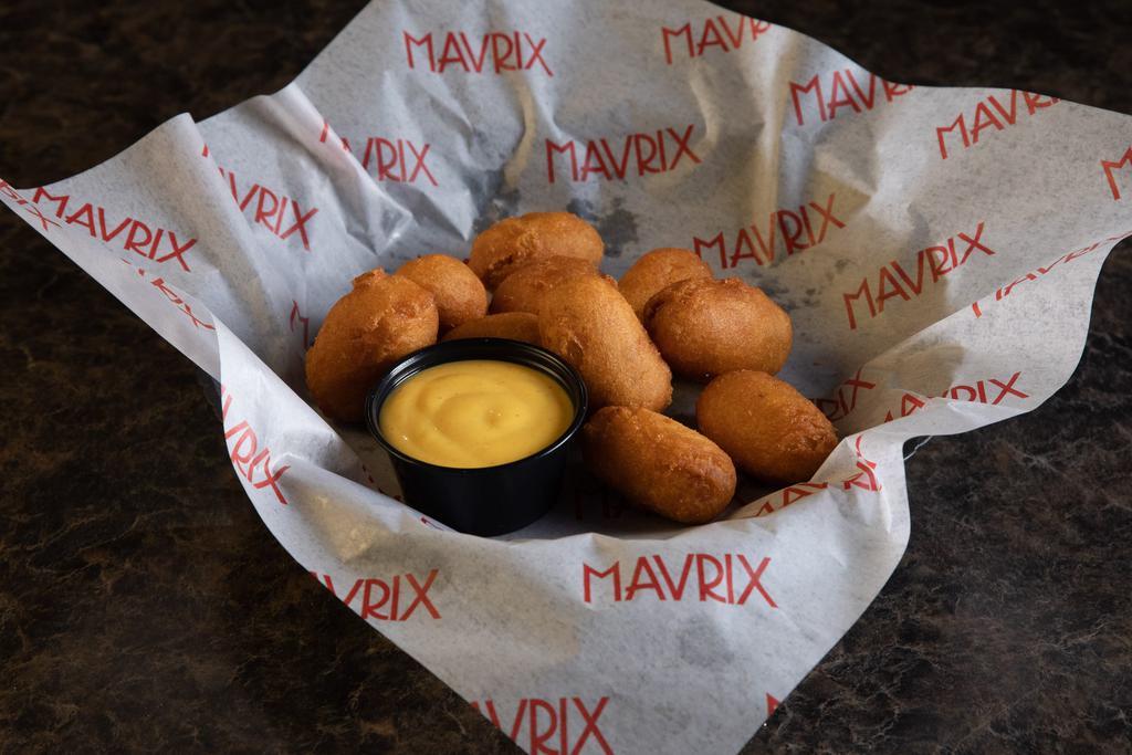 Mini Corn Dogs · Served with honey mustard.
